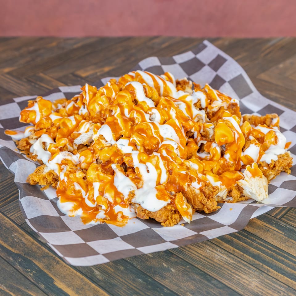 Crispy fried chicken pieces generously drizzled with orange buffalo and white ranch sauces.