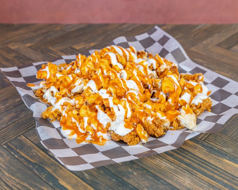 Crispy fried chicken pieces generously drizzled with orange buffalo and white ranch sauces.